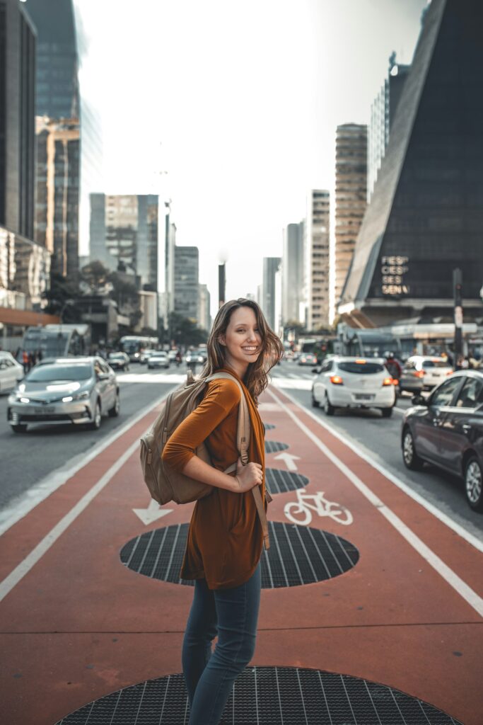 Solo traveler with a backpack exploring the city, representing independent travel